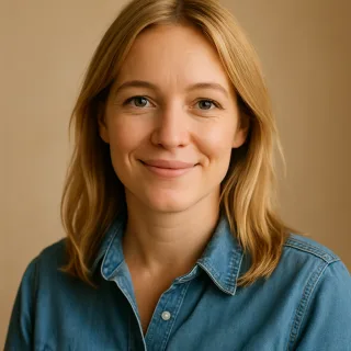 A woman with blonde hair in a denim shirt.